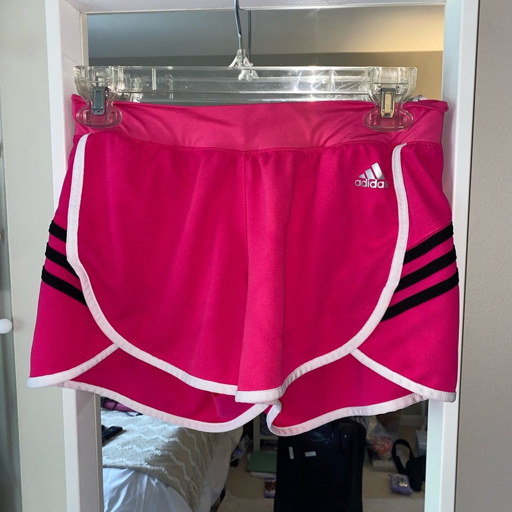 Bright pink Adidas athletic shorts